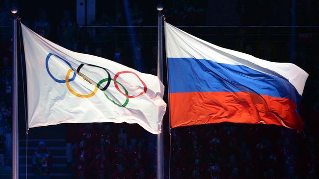 The Olympic and Russian flags during the opening ceremony of the 2014 Sochi Winter Olympics.