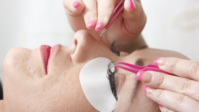 Nikki Earnshaw having silk eyelash extensions put on by owner of B Indulged Jessika Brigginshaw.Photo: Sarah Harvey / The Queensland Times