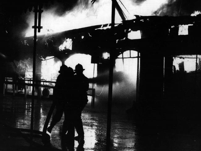 Firemen at scene of Ghost Train ride fire that killed seven people at Luna Park in Sydney.