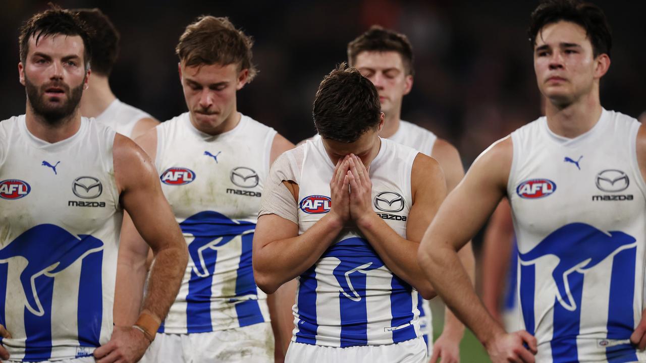 A dejected North Melbourne leave the field after another loss. Picture: Michael Klein