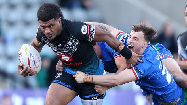 Taniela Sadrugu of Fiji breaks through a tackle from Jack Colovatti of Italy. Picture: Getty Images