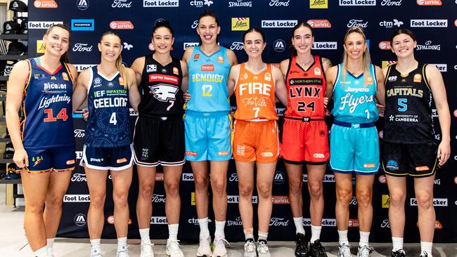 Isobel Borlase of the Adelaide Lightning, Jaz Shelley of Geelong United, Emma Clarke of the Sydney Flames, Marianna Tolo of the Bendigo Spirit, Courtney Woods of the Townsville Fire, Anneli Maley of the Perth Lynx, Bec Cole of the Southside Flyers and Jade Melbourne of the UC Capitals pose for a photo during the WNBL 24/25 Season Launch at Foot Locker Melbourne Central on October 23, 2024 in Melbourne, Australia.