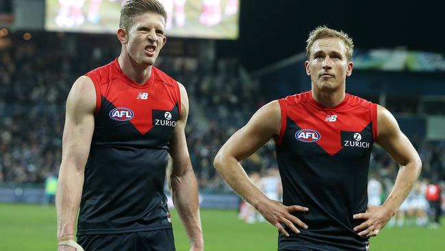 Melbourne's Sam Frost and Bernie Vince leave GMHBA Stadium after the loss. Pic: Michael Klein