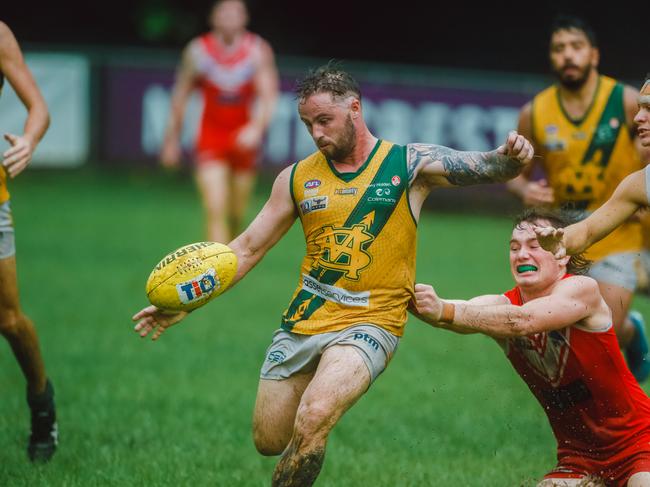 Jack Landt gets the ball away from Waratahs defence in Round 16 NTFL Men's Premiership League. Picture: Glenn Campbell