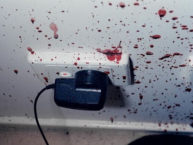 The mobile phone charger and bedroom wall was covered in blood. Picture: Supreme Court of NSW