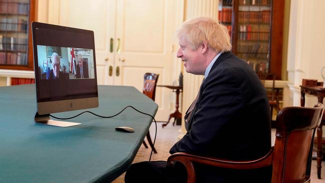 Boris Johnson speaks to 102-year-old war veteran Ernie Horsfall from the cabinet room inside 10 Downing Street on the 75th anniversary of VE Day on Friday. Picture: 10 Downing Street via AFP)