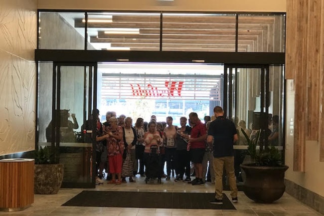 Crowds wait at the door as the new Westfield at Coomera Town Centre prepares to open for the first time.