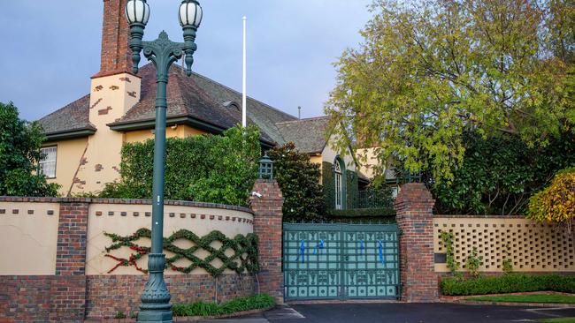 Blue ribbons on the fence of Fox’s Toorak home in honour of four Victoria Police officers who died on the Eastern Freeway. Picture: Mark Stewart