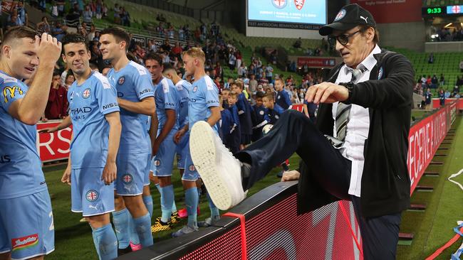 Melbourne City coach Erick Mombaerts joins his team to celebrate the win. Picture: AAP