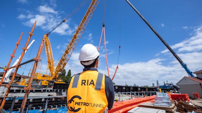 A worker oversees the ongoing construction.