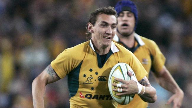 Wallabies player Mat Rogers on his way to scoring a try during Australia v South Africa Tri-Nations game at Testra Stadium at Homebush in 2006.