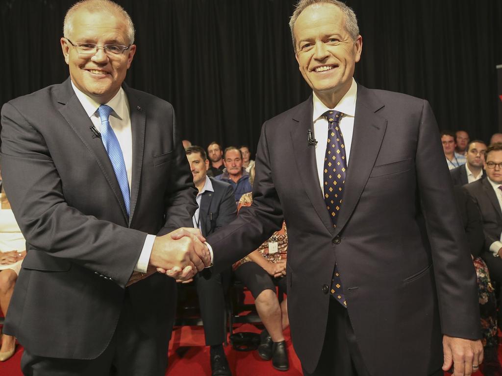 The two leaders beamed as they shook hands before the testy debate. Picture: Nic Ellis/Pool/AFP