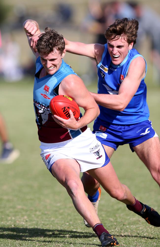 VBFL: Barwon Heads v Modewarre. Modewarre's Callan Farrell and Barwon Heads Charlie Hurst. Picture: Mike Dugdale