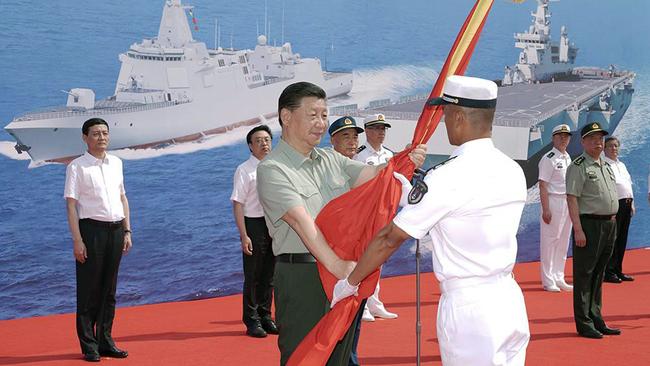 Chinese President Xi Jinping attends the commissioning ceremony at a military port in the southern city of Sanya. Picture: CGNT