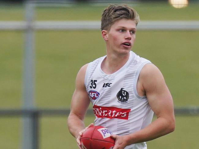 Jay Rantall runs with the ball during a Collingwood Magpies AFL training session at Olympic Park, in Melbourne, Monday, June 1, 2020. (AAP Image/Michael Dodge) NO ARCHIVING