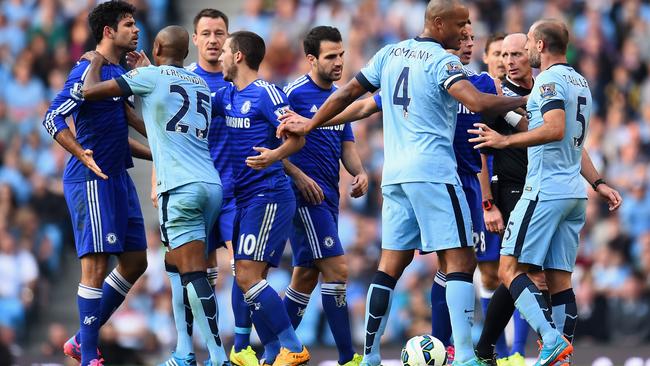 MANCHESTER, ENGLAND - SEPTEMBER 21: Pablo Zabaleta of Manchester City is separated from Diego Costa of Chelsea by his team-mates during the Barclays Premier League match between Manchester City and Chelsea at the Etihad Stadium on September 21, 2014 in Manchester, England. (Photo by Shaun Botterill/Getty Images)