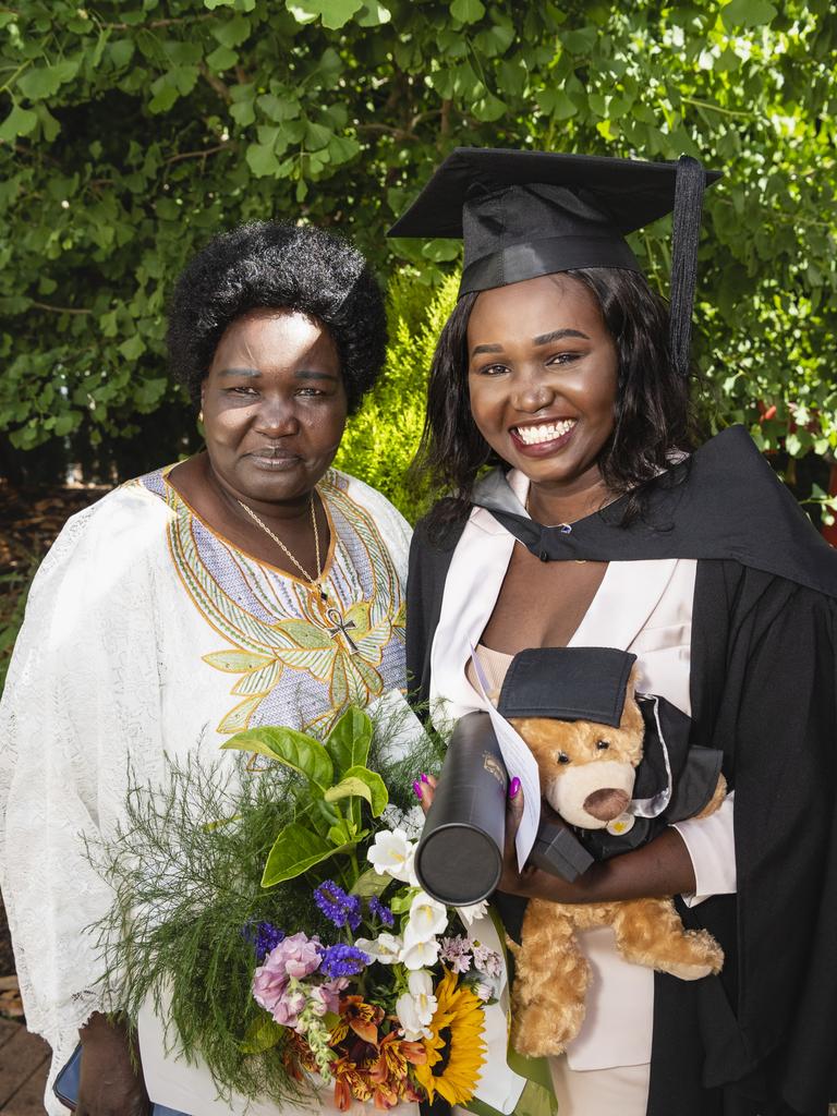 Bachelor of Commerce and Bachelor of Business graduate Mary Ngor celebrates with mum Sarah Duot at the UniSQ graduation ceremony at Empire Theatres, Tuesday, December 13, 2022. Picture: Kevin Farmer