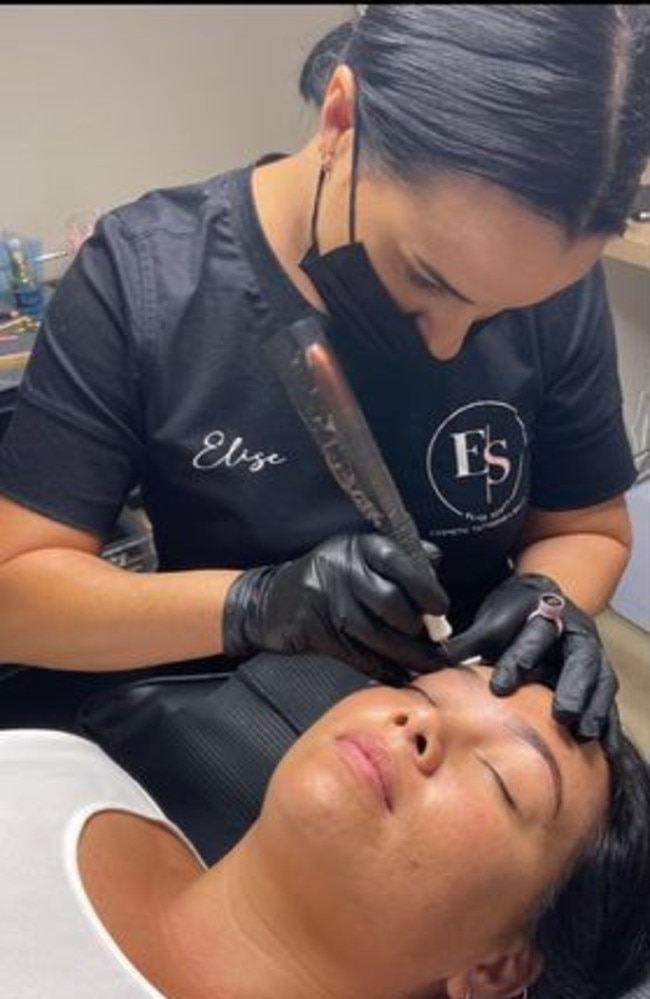 Elise Scott, pictured tattooing her client's brows.