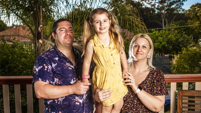 Aaron and Amanda Walker with daughter Aria, 3. Mrs Walker says she pays nearly the same amount of money on groceries to feed their family of five as they do on childcare for one child. Picture: Nigel Hallett