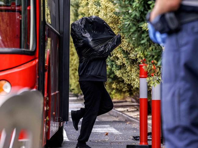 MELBOURNE , AUSTRALIA - NewsWire Photos FEBRUARY 16, 2021 : Covid-19 positive people arrive at The Pullman Hotel in Albert Park, after being evacuated from the Holiday Inn in the CBD due to water damage. Picture : NCA NewsWire  /  Ian Currie