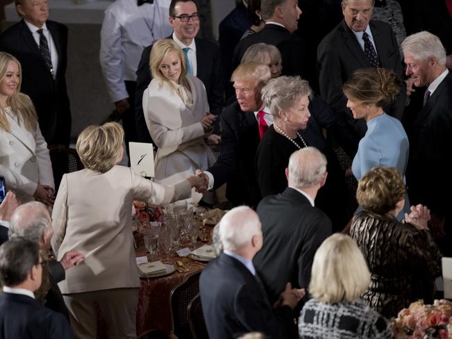Newly sworn in President Donald Trump with his wife first lady Melania Trump, shakes hands with Hillary Clinton, as they arrive for the inaugural luncheon at the Statuary Hall in the Capitol on January 20, 2017, in Washington. Picture: AP