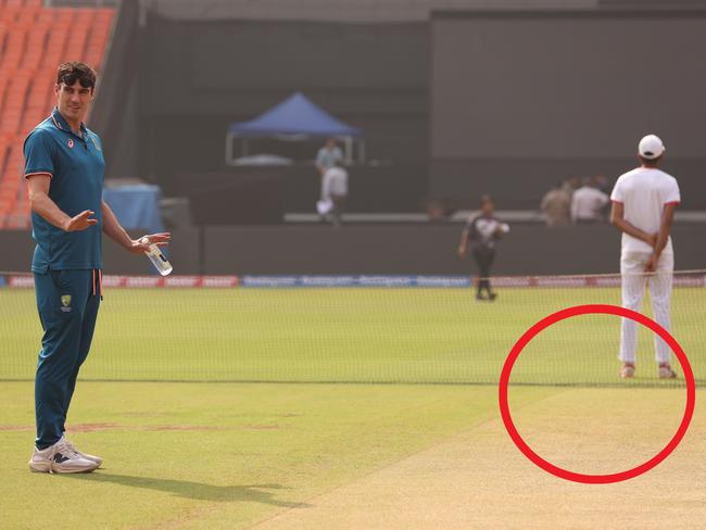 AHMEDABAD, INDIA - NOVEMBER 18: Pat Cummins of Australia inspects the pitch prior to an Australian press conference ahead of the the ICC Men's Cricket World Cup Final 2023 at Narendra Modi Stadium on November 18, 2023 in Ahmedabad, India. (Photo by Robert Cianflone/Getty Images)