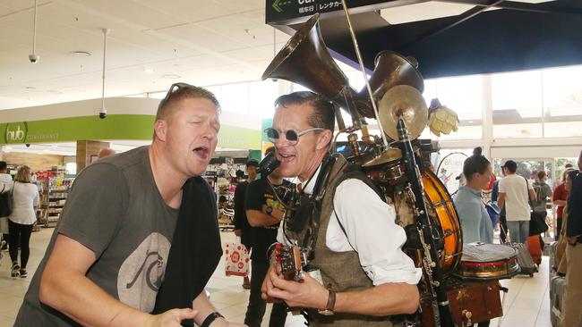 One man band,  Uptown Brown, is performing at the Gold Coast Airport over the next few days welcoming crowds to Blues on Broadbeach. David Winiata from Gosford joins in a sing a long with Uptown Brown. Picture Glenn Hampson