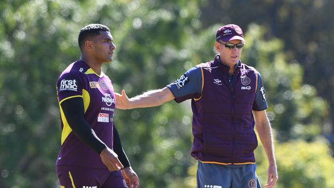 Tevita Pangai Junior and coach Wayne Bennett are seen during the Brisbane Broncos training session in Brisbane, Wednesday, August 22, 2018. (AAP Image/Dave Hunt) NO ARCHIVING