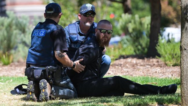 An alleged National Socialist Network member is arrested during a ‘counter-protest’ on North Terrace and East Terrace Australia Day. Picture: Tracey Nearmy/Getty