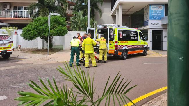 Paramedics treat one of the women who was trapped beneath the LandCruiser.