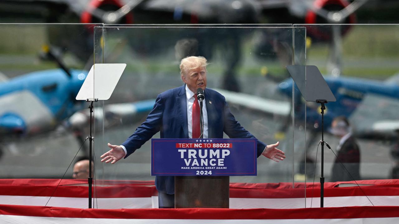 Donald Trump appeared behind tall bulletproof glass panels at his first outdoor rally since surviving an assassination attempt. Picture: Peter Zay / AFP