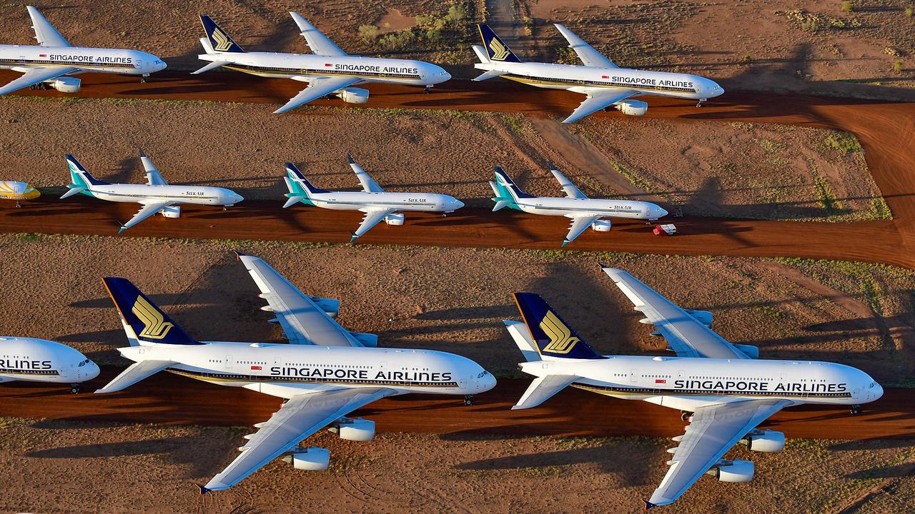 The newly arrived Singapore Airlines A380s dwarfed the planes already stored at the Asia Pacific Aircraft Storage near Alice Springs. Picture: Steve Strike Photography