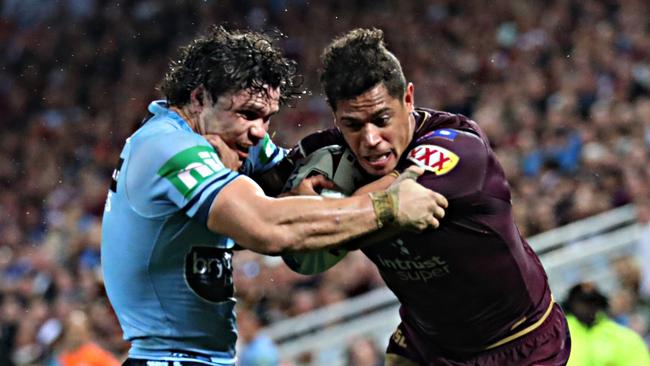 Dane Gagai tries to beat Blues centre James Roberts. Picture: Annette Dew