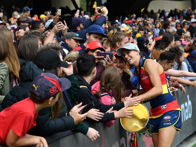 Randall celebrates with fans after her side’s 45-point thrashing of Carlton in the 2019 grand final. Picture: David Mariuz