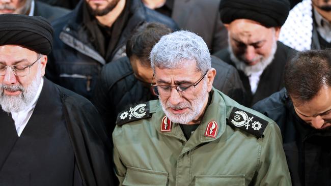 Gen. Esmail Ghaani, newly appointed commander of Iran's Revolutionary Guards Quds Force, weeps while praying over his predecessor’s coffin. Picture: AP.