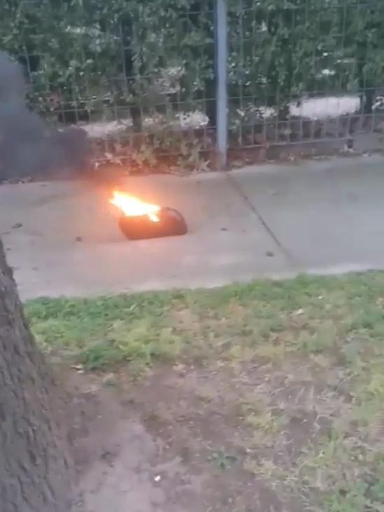 He removed the flaming battery from his bike frame.