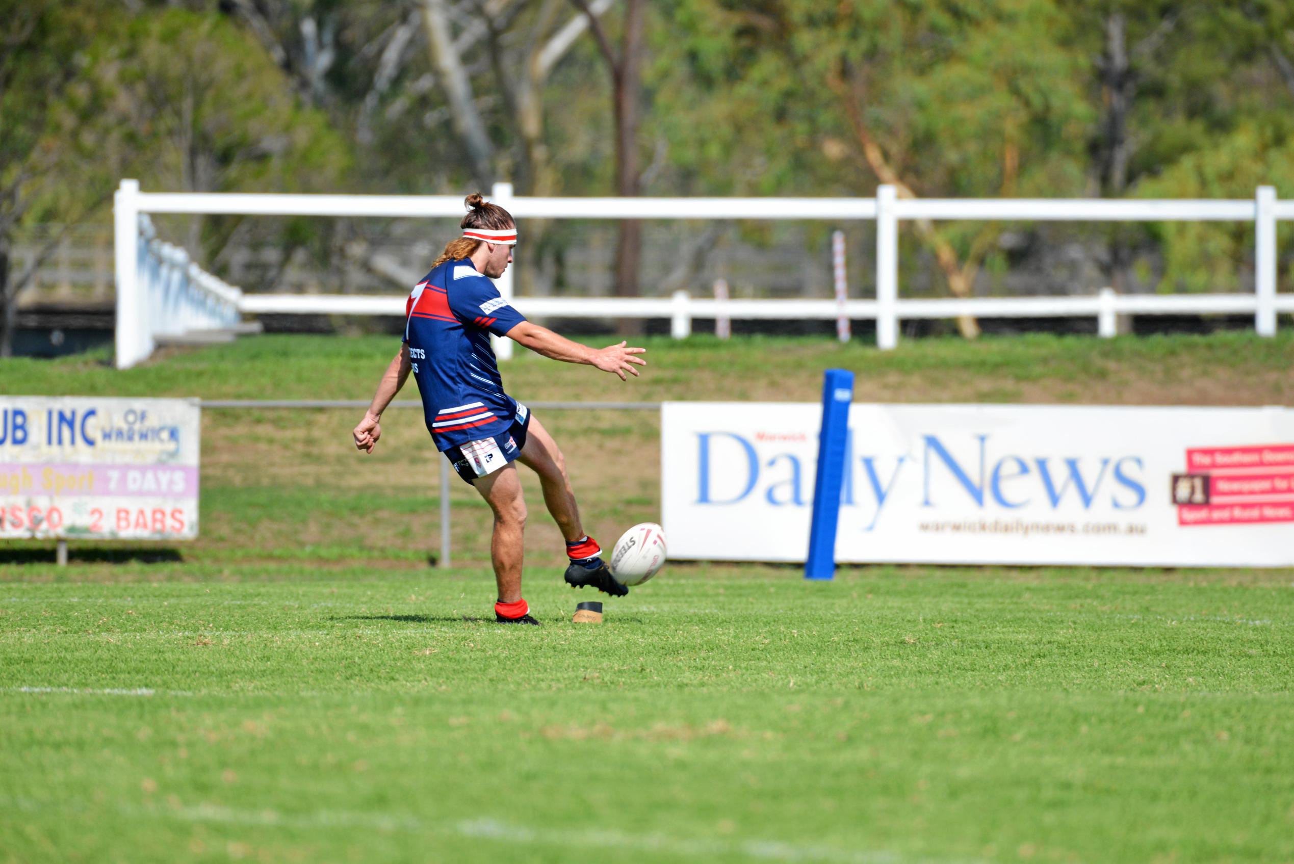 Aden Howard kicks for goal for Warwick in the second-division game against Stanthorpe. Picture: Gerard Walsh