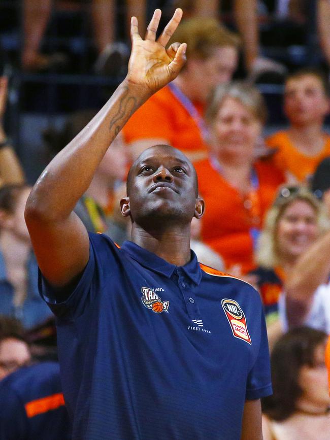 An injured Kouat Noi signals three points in the National Basketball League (NBL) New Year's Eve match between the Cairns Taipans and the South East Melbourne Phoenix, held at the Cairns Convention Centre. PICTURE: BRENDAN RADKE