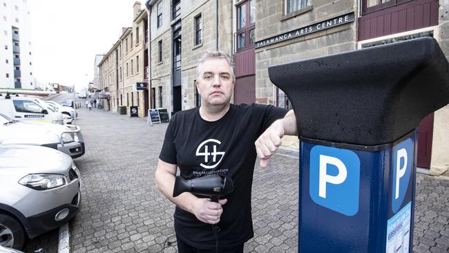 Edwin Johnstone, co-owner of Some Hallucination hairdressing salon at Salamanca, is not happy about the parking price increase near his business. Picture: Eddie Safarik