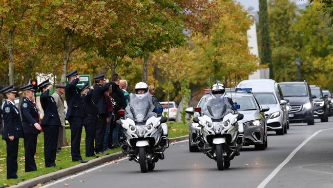 Police form a guard of honour during the cortege of Chief Superintendent Joanne Shanahan outside Norwood Police Station. Picture: David Mariuz/AAP