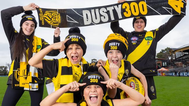 Back row: Kate Montgomery and Nathaniel Lowe, Front row L-r Charlie, 9, Alfie, 11 and Jack, 8Richmond fans with Dusty merchandise that will be sold in lead up to his 300th game. Dustin Martin at Richmond training. Picture: Jason Edwards