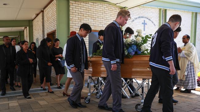 Family and friends at Calvin Wijeweera’s funeral at St Gerard Majella's Catholic Parish Church, Carlingford, on December 15. Picture: Justin LloydS