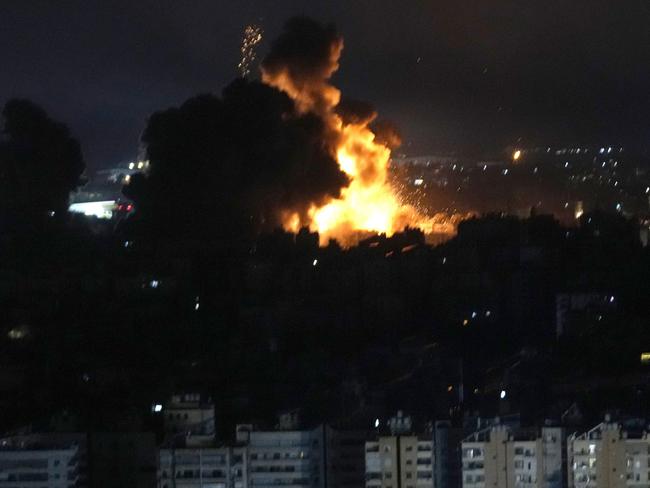 Flames rise from Israeli airstrikes in Dahiyeh, Beirut, Lebanon, Friday, Oct. 4, 2024. (AP Photo/Hussein Malla)