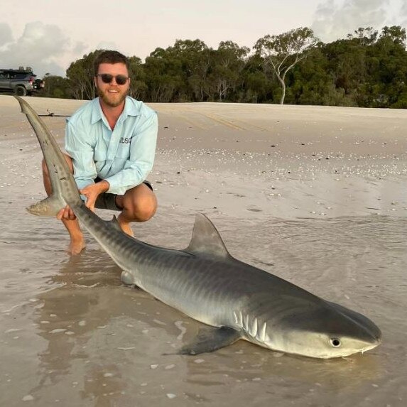 Jack Boyd with shark caught off K'gari. Picture: Supplied