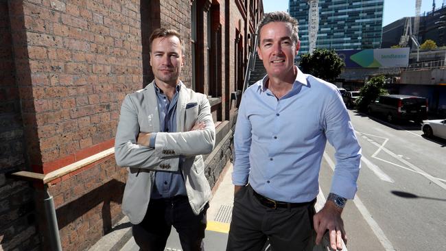 Shaun Holthouse, left, with his replacement as chief executive of Catapult, Joe Powell, in Melbourne’s Docklands. Picture: David Geraghty