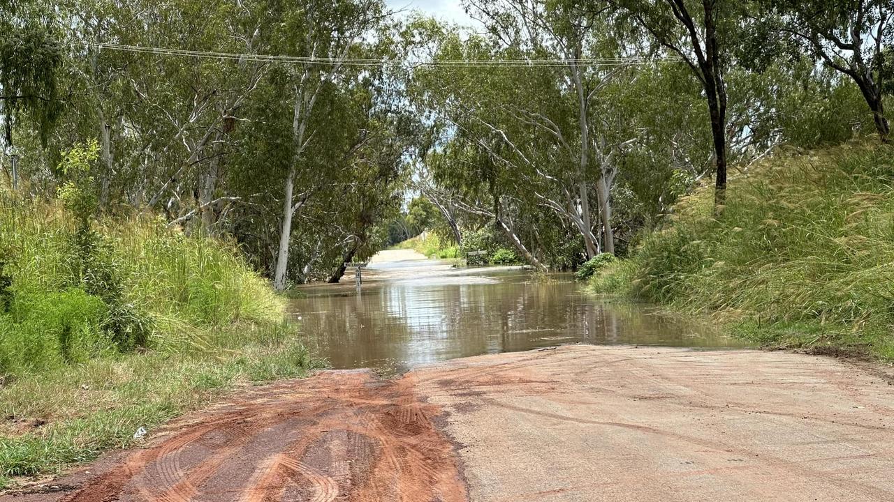 Resident-captured photos of rising waters along Waterhouse River as the Bureau of Meteorology issues a flood watch across the Top End.