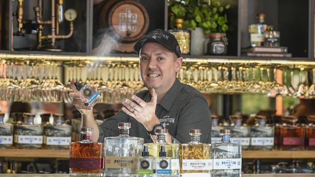 Prohibition Liquor Co’s Adam Carpenter with the hand sanitiser. Picture: Roy VanDerVegt