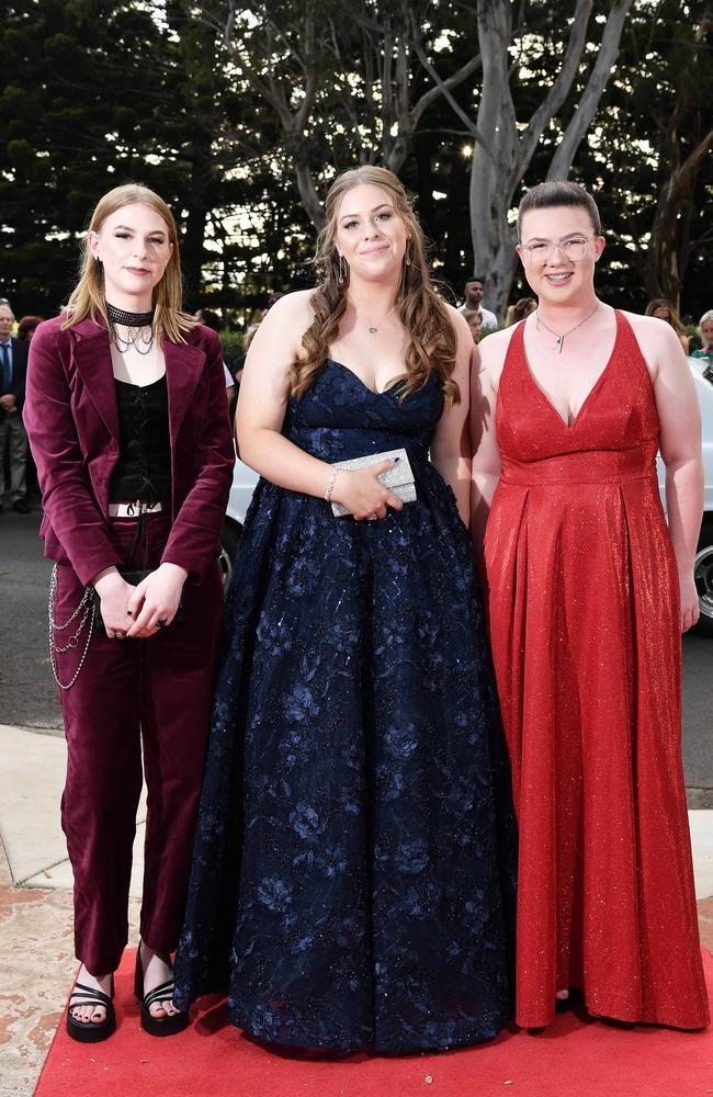 Piper Button, Emma Hawes and Bella Berry at Centenary Heights State High School formal. Picture; Patrick Woods.