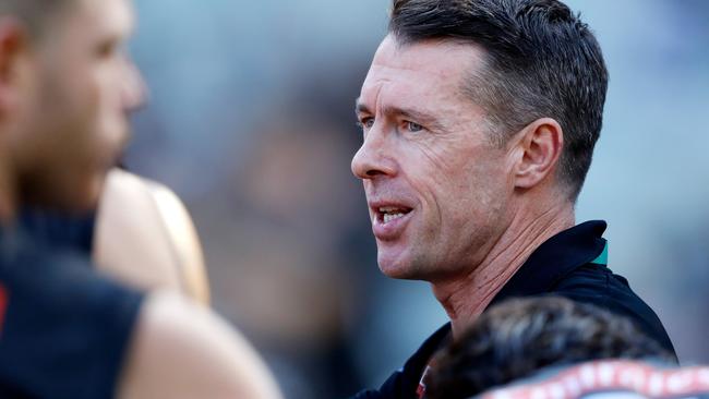 Craig McRae addresses his players during as the Magpies made it back to back wins to start the season.