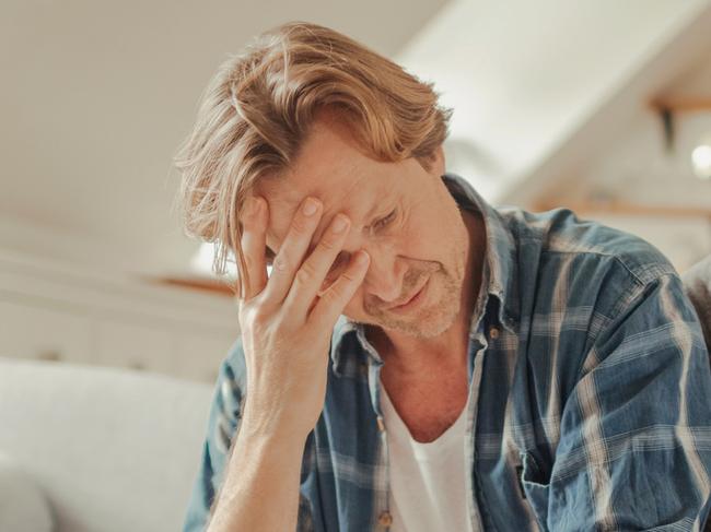 Photo of worried mature couple calculating home finances